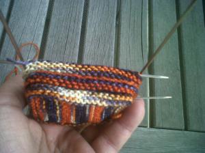 Side view of the bootie after the sides are knitted. The knit stitches don't show as they fold themselves in, but they are there.