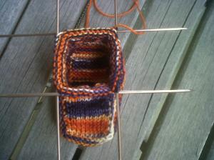 Knitting the rounds of the ankle of the bootie.