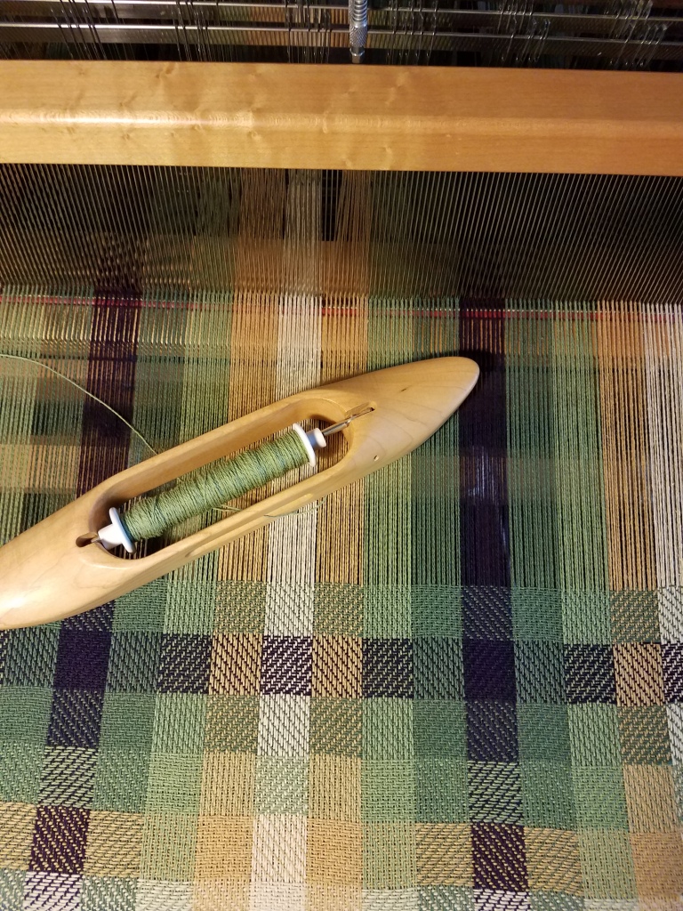 Woven fabric on the loom.