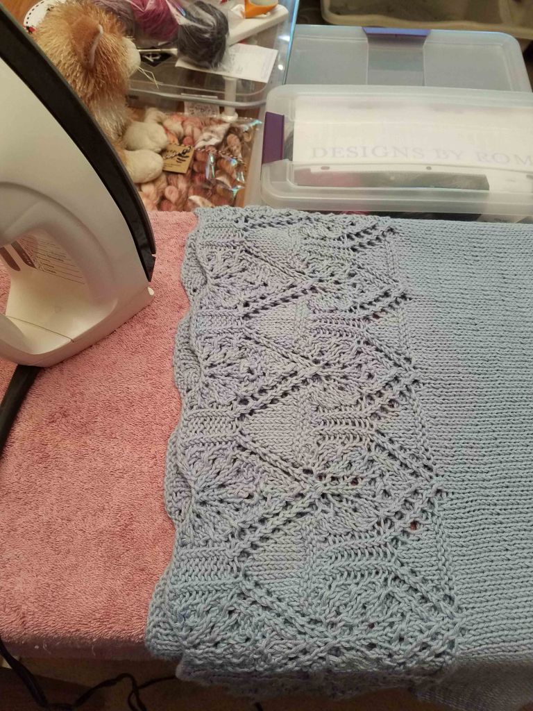 Steam blocking sweater.