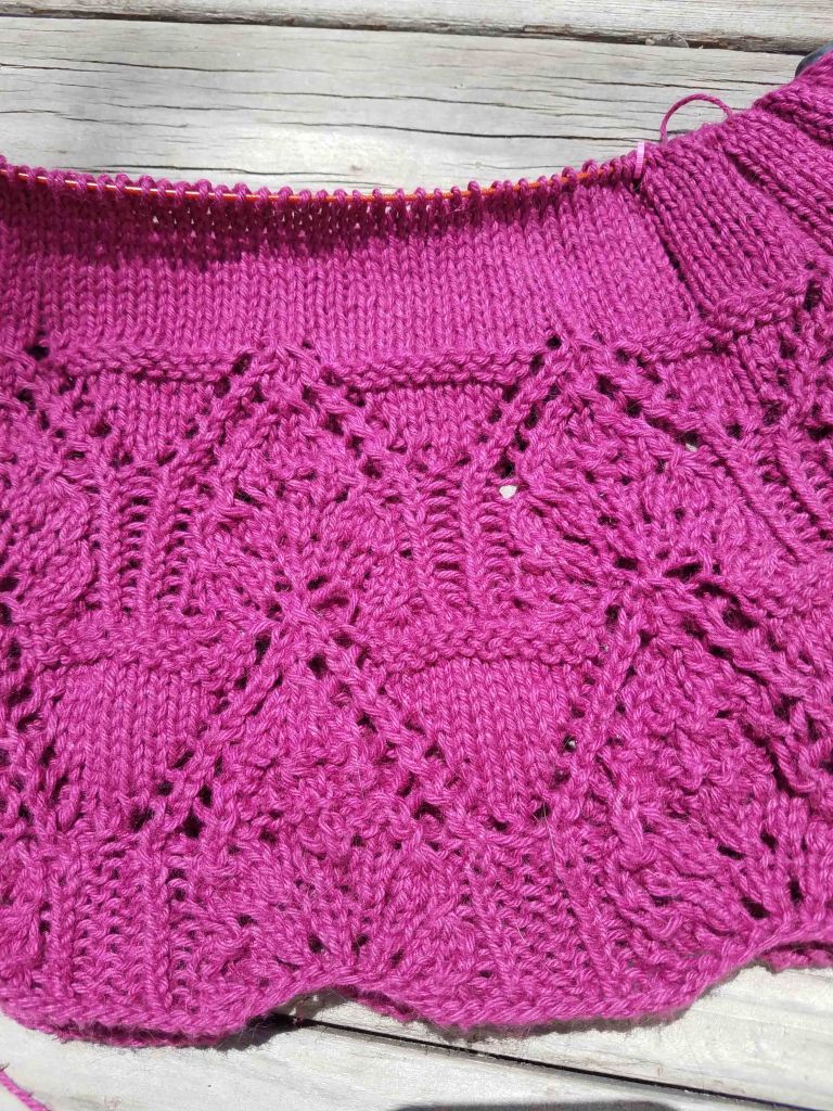 Lace detail on knitting.