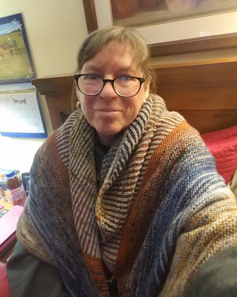 Author wearing an hand knit shawl.