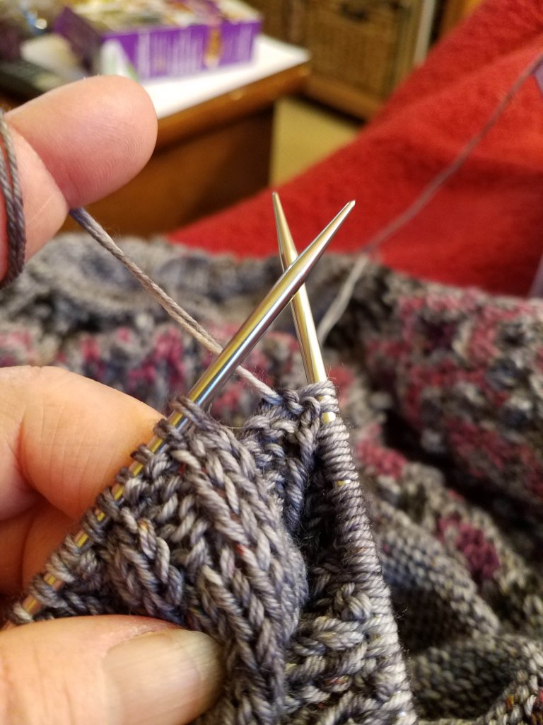 Details of yarn in the sleeve ribbing.